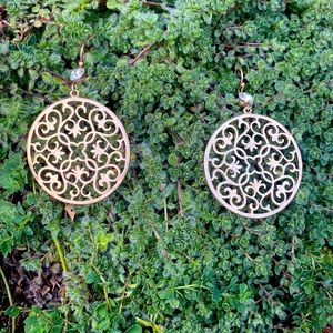 Women’s gold tone earrings with faux diamond accent